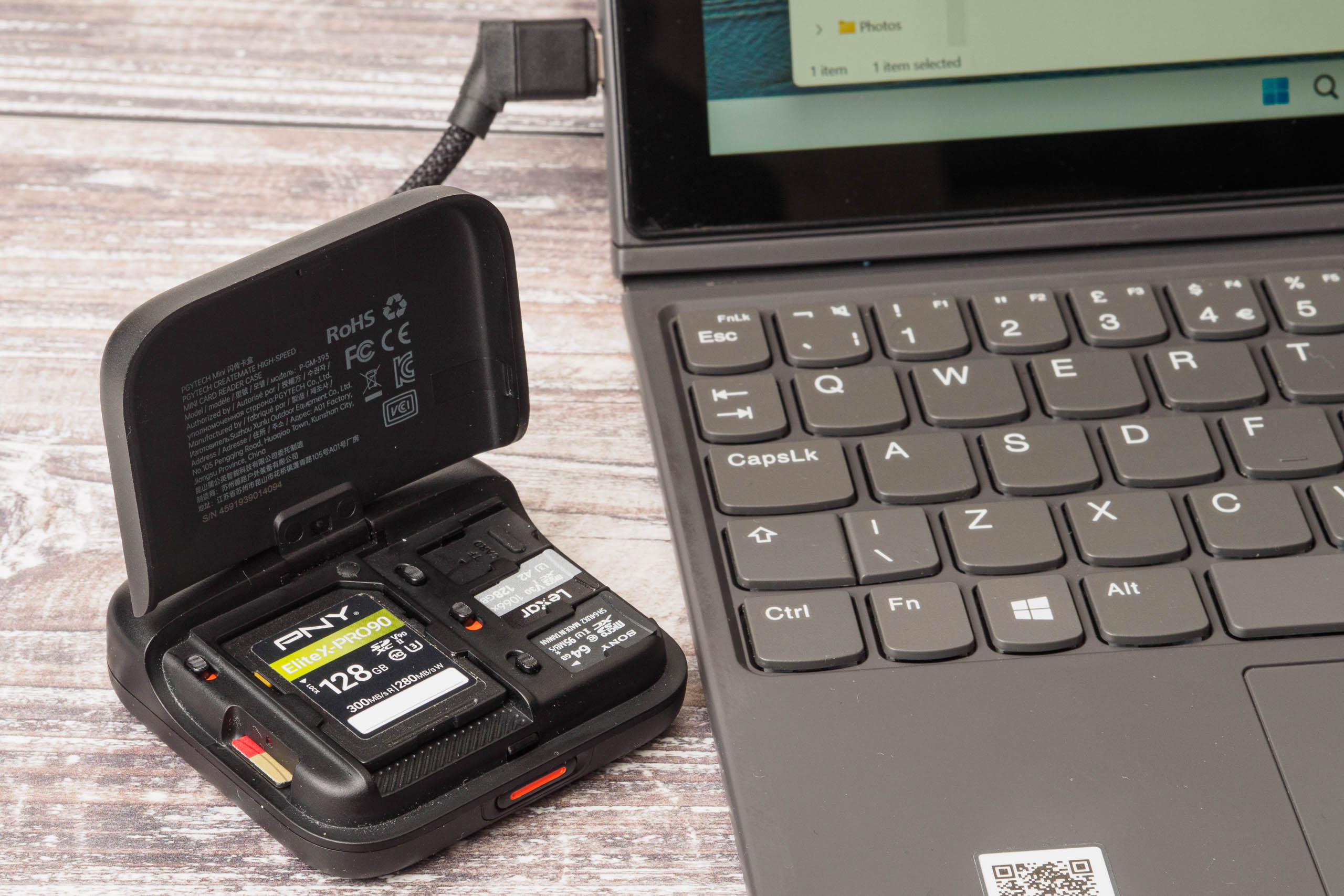PGYTech CreateMate High-Speed Mini Card Reader Case connected to mini laptop