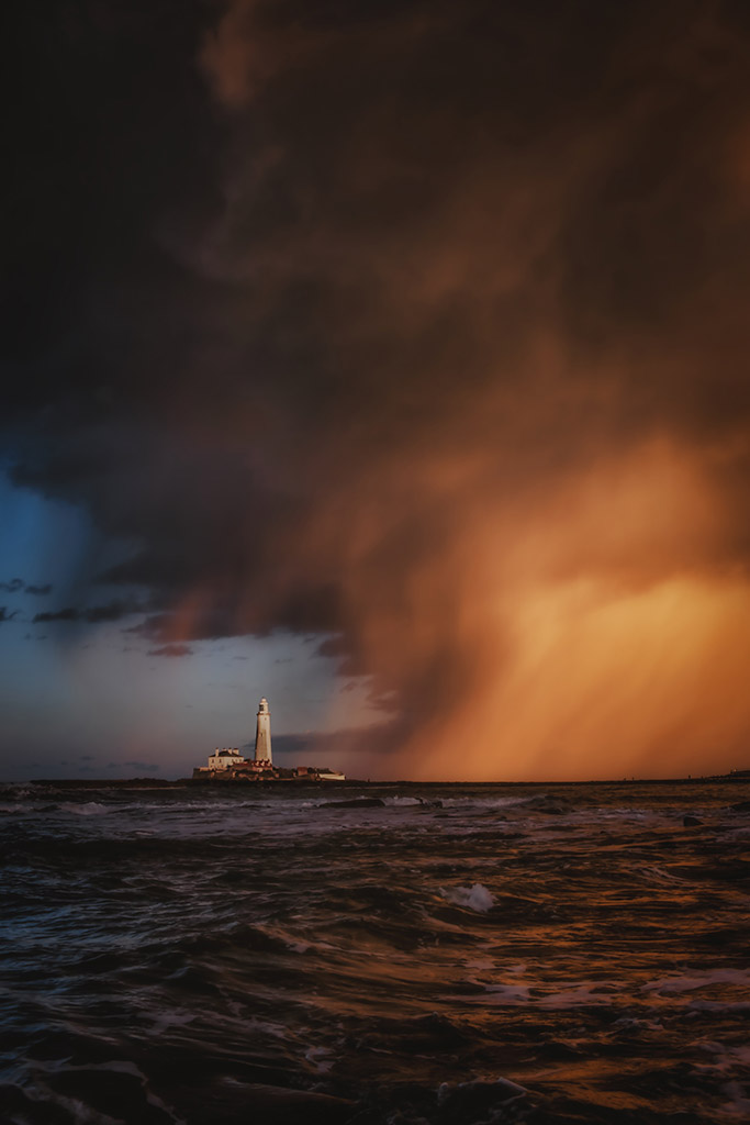 stormy sunset scene over a lighthouse