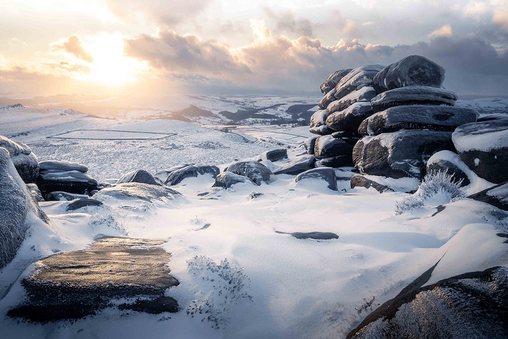 view of Higger Tor landscape in snow
