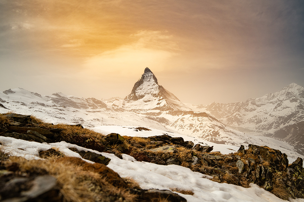 view of the matterhorn from snow-covered Riffelsee in Switzerland