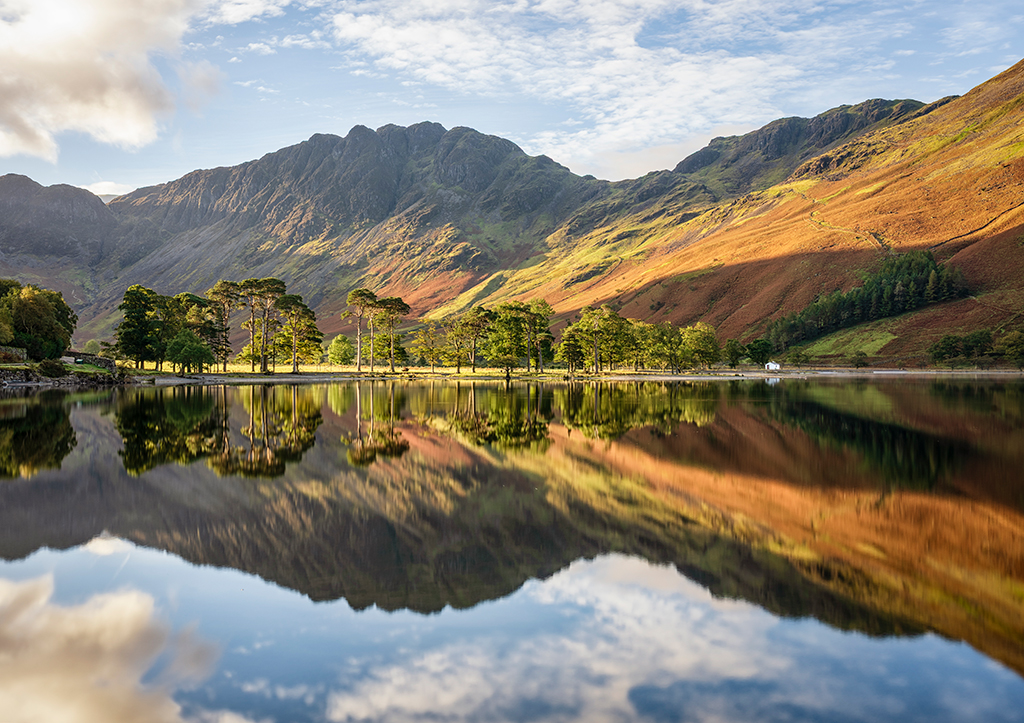 landscape reflection of lake buttermere in autumn