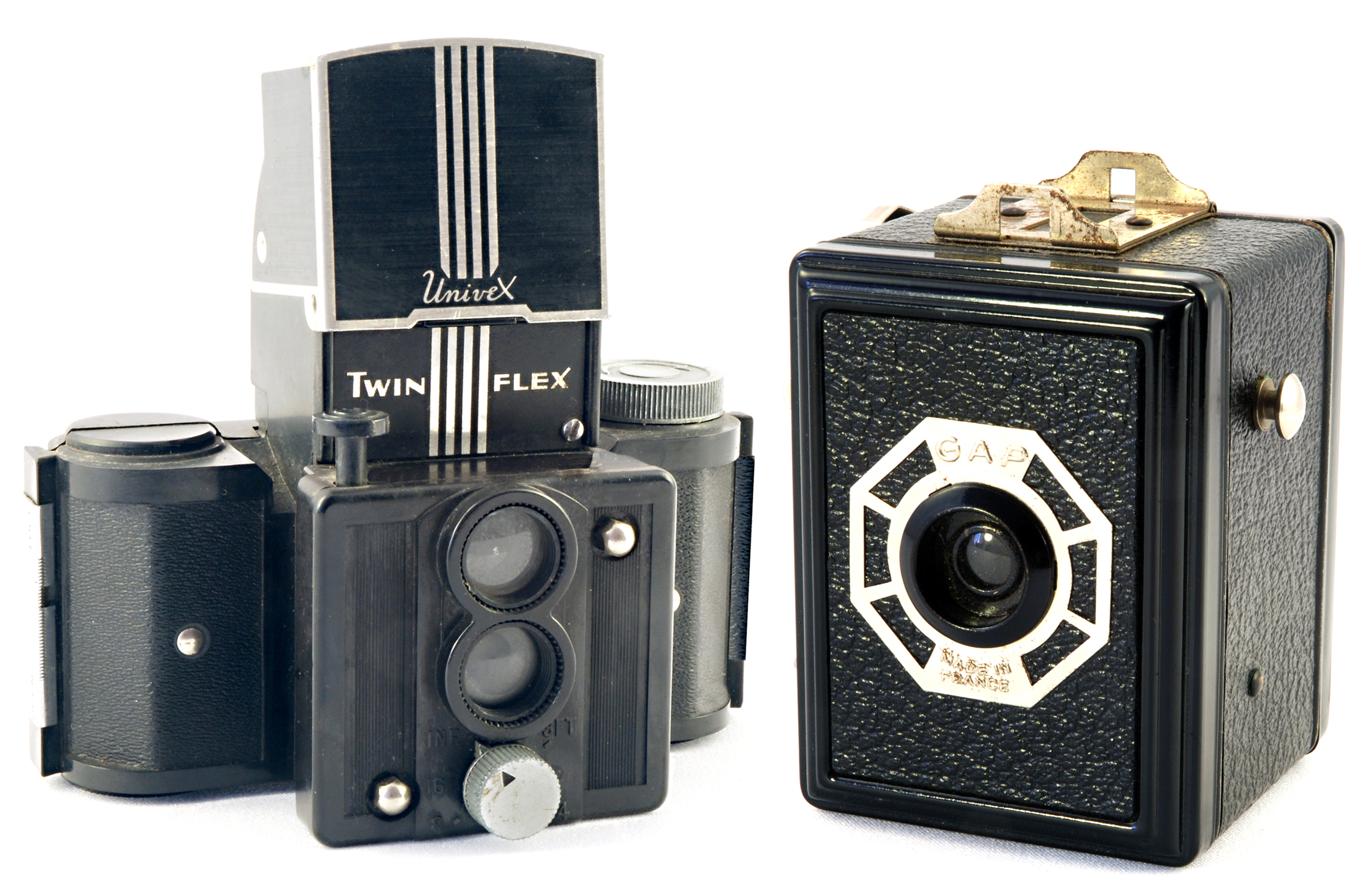 More subtle hints of Art Deco in the American Twinflex (left) and French Gap box camera