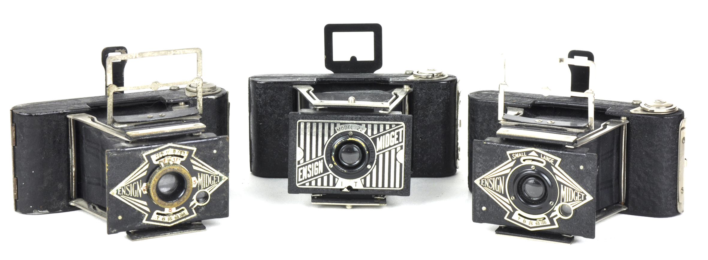 Art Deco faceplates on three Ensign Midgets