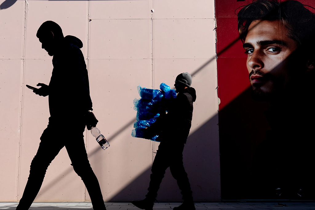 silhouette of people walking on the street