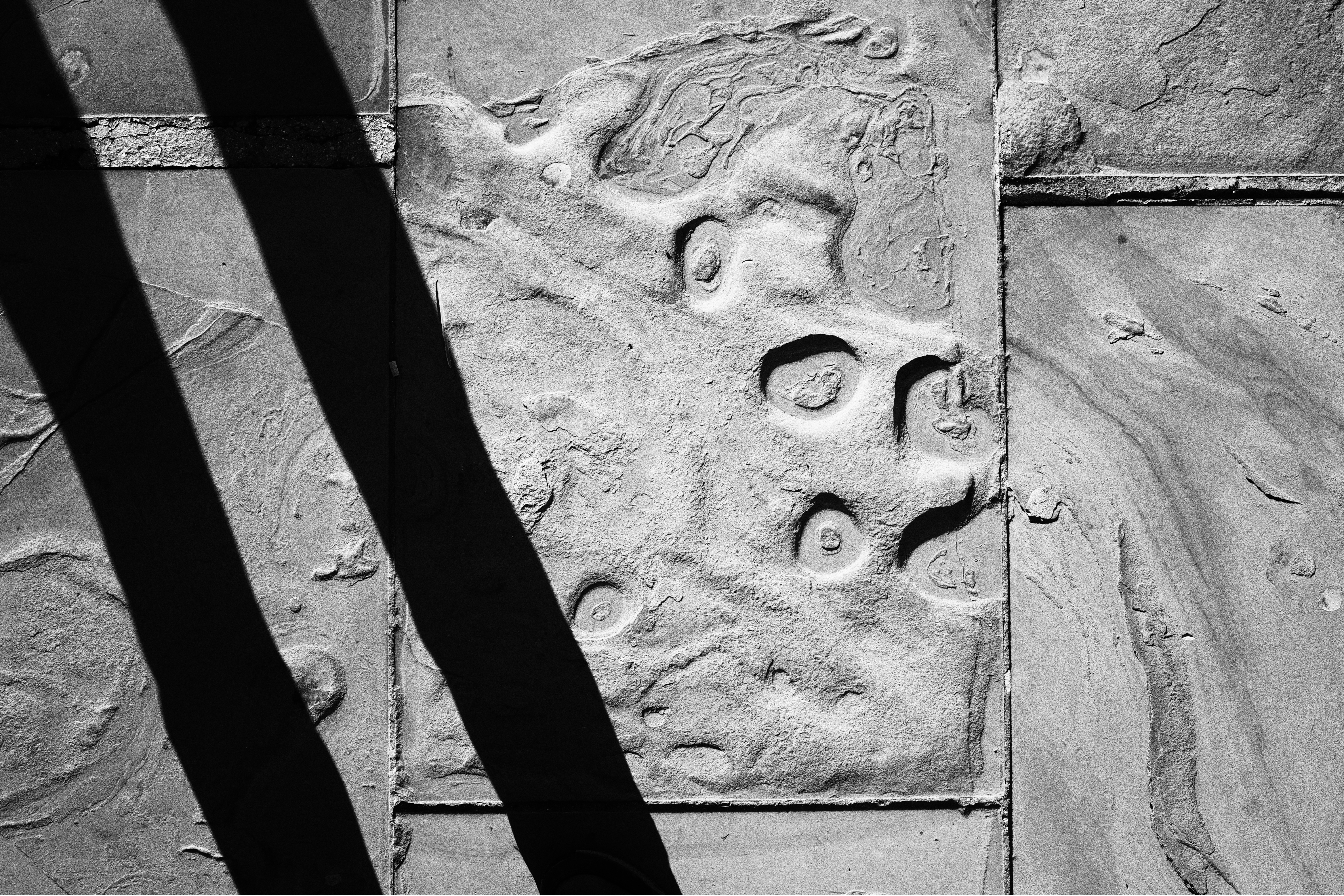 Ricoh GR IV Monochrome sample image: pavement abstract. 